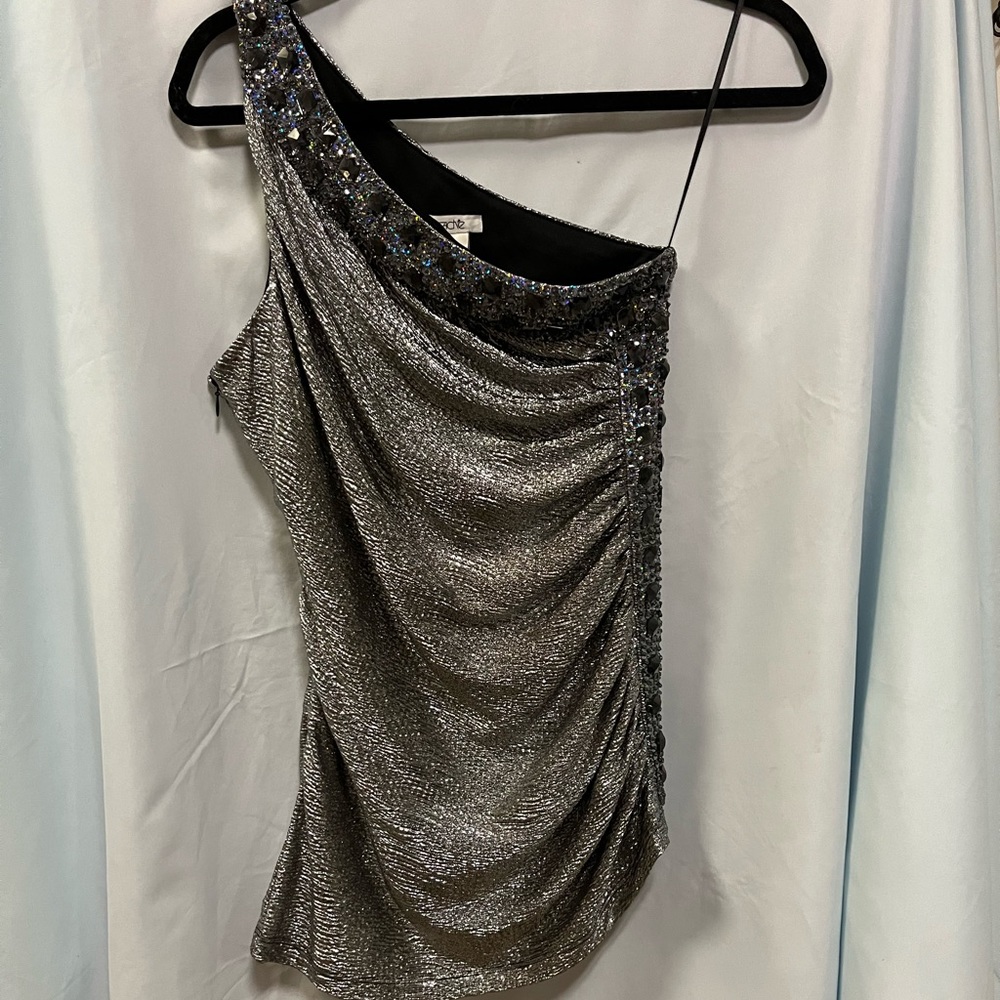 Off the shoulder top with gems & sequins along the front and side .